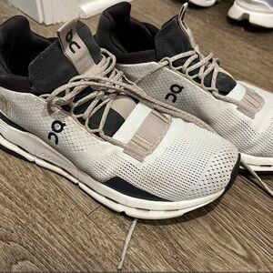 On Running White and Black Athletic Shoes with Breathable Mesh and Sleek Design